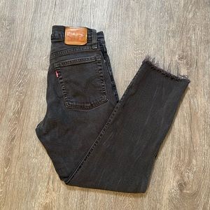 Levi’s faded black raw hem jeans